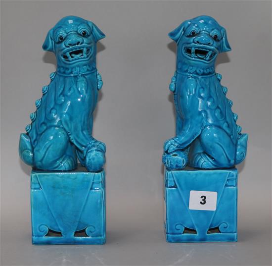 A pair of Chinese blue-glazed Buddhist lion figures 26.5cm
